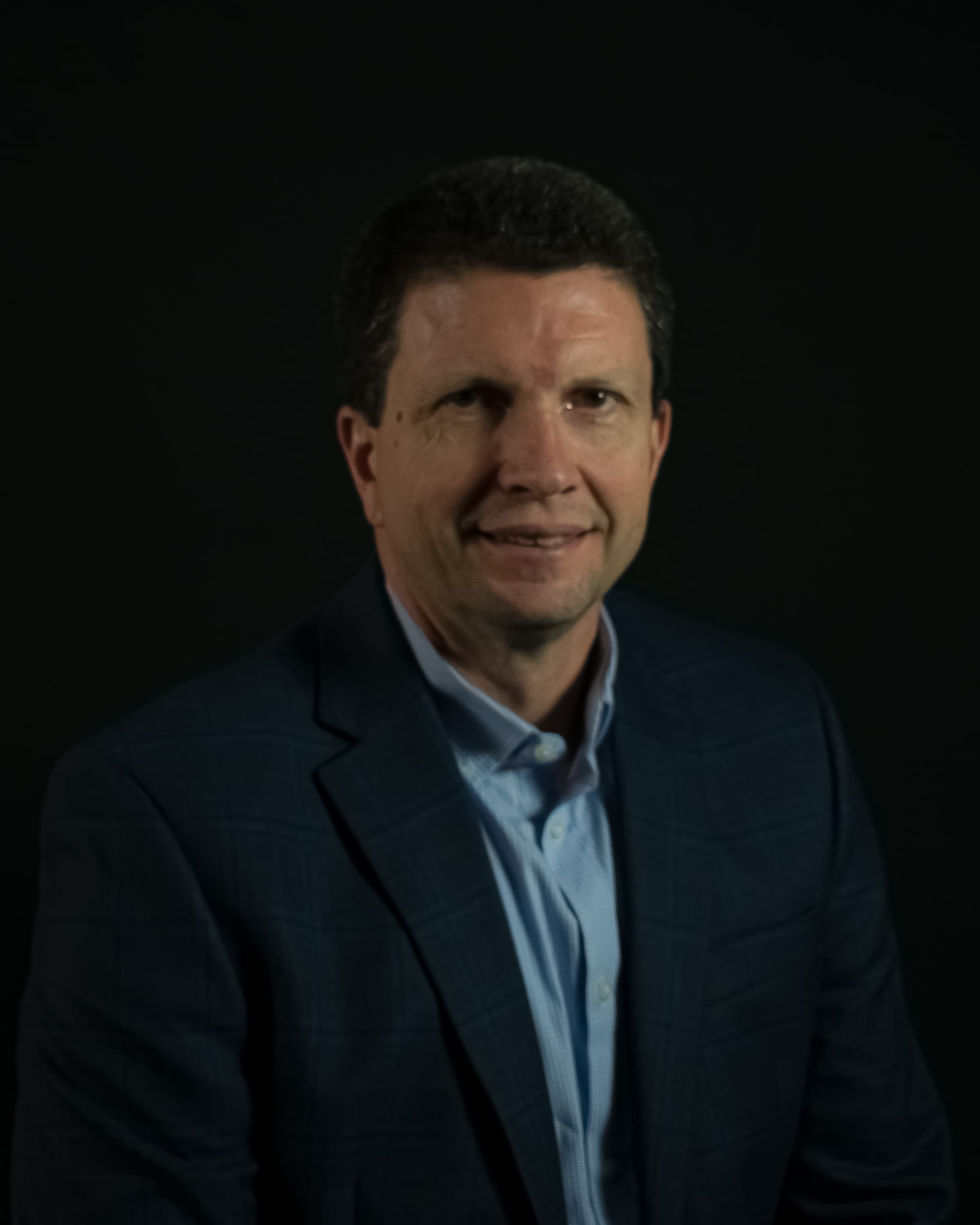 Headshot of Chris Twiner, Director of Contracts and Pricing